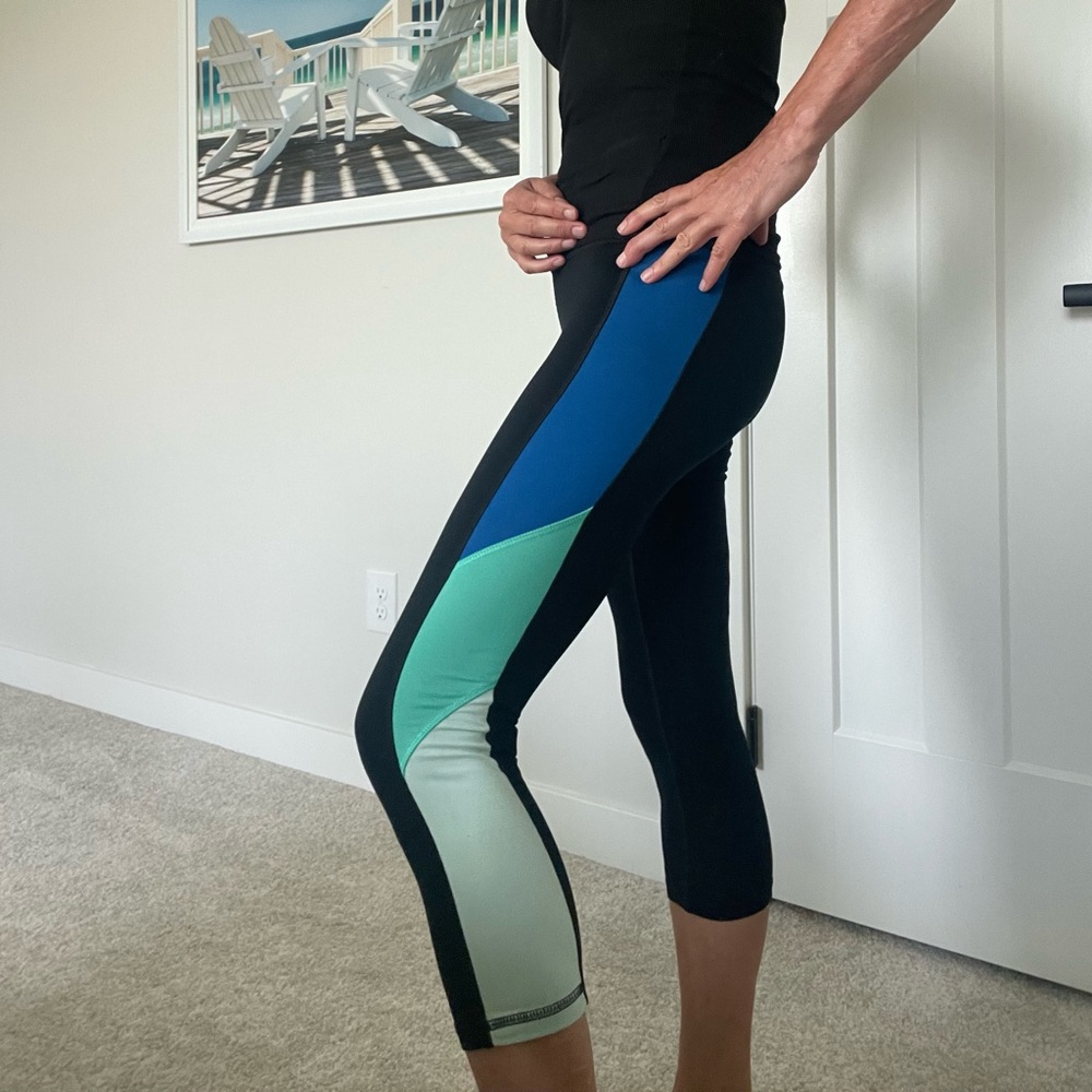 Two pairs of capri leggings S . One pink/ black FILA